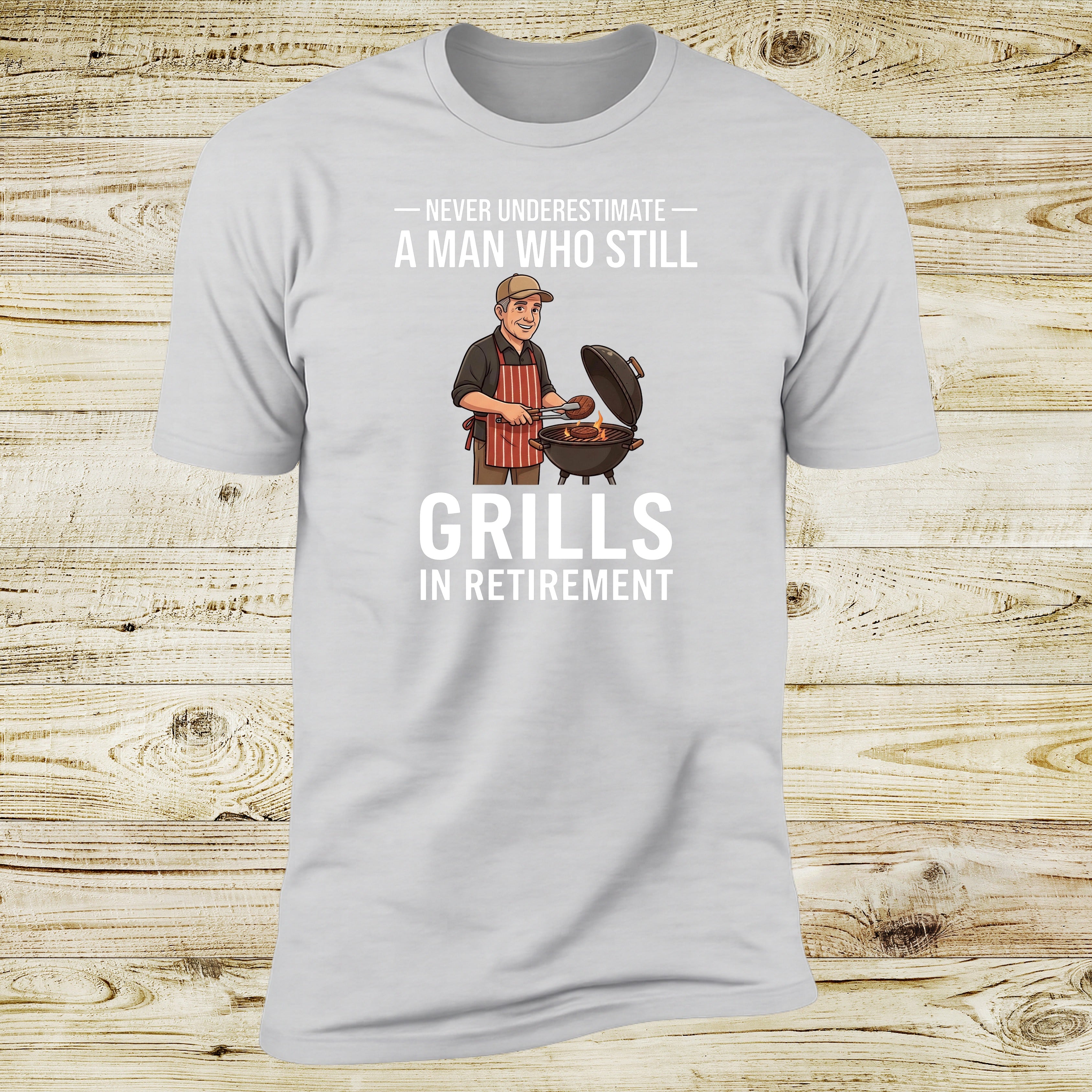 Never Underestimate A Man Who Still Grills In Retirement | Deluxe Tee